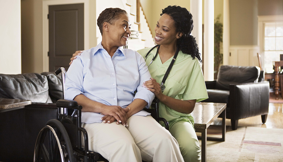 Smiling senior and caregiver